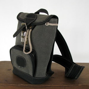 Mochila pequeña lona unisex bolso bandolera gris monedero textil