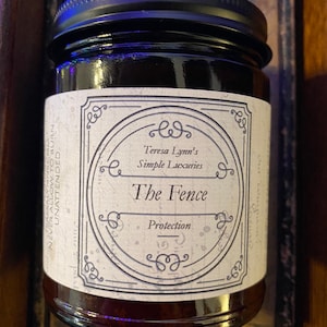 The Fence, Protection and Boundary Setting Wooden Wick Soy Wax Candle in a dark Amber jar with a metal lid.Cedar and Redwood cleansing and protection blessings.
Cedar wood and Redwood essential oil, when used for charms are often referred to as “The fence” due to its powerful characteristic of forcing harmful projections out and keeping protective powers in. Crafted in Monrovia, Indiana at Teresa Lynns Simple Luxuries