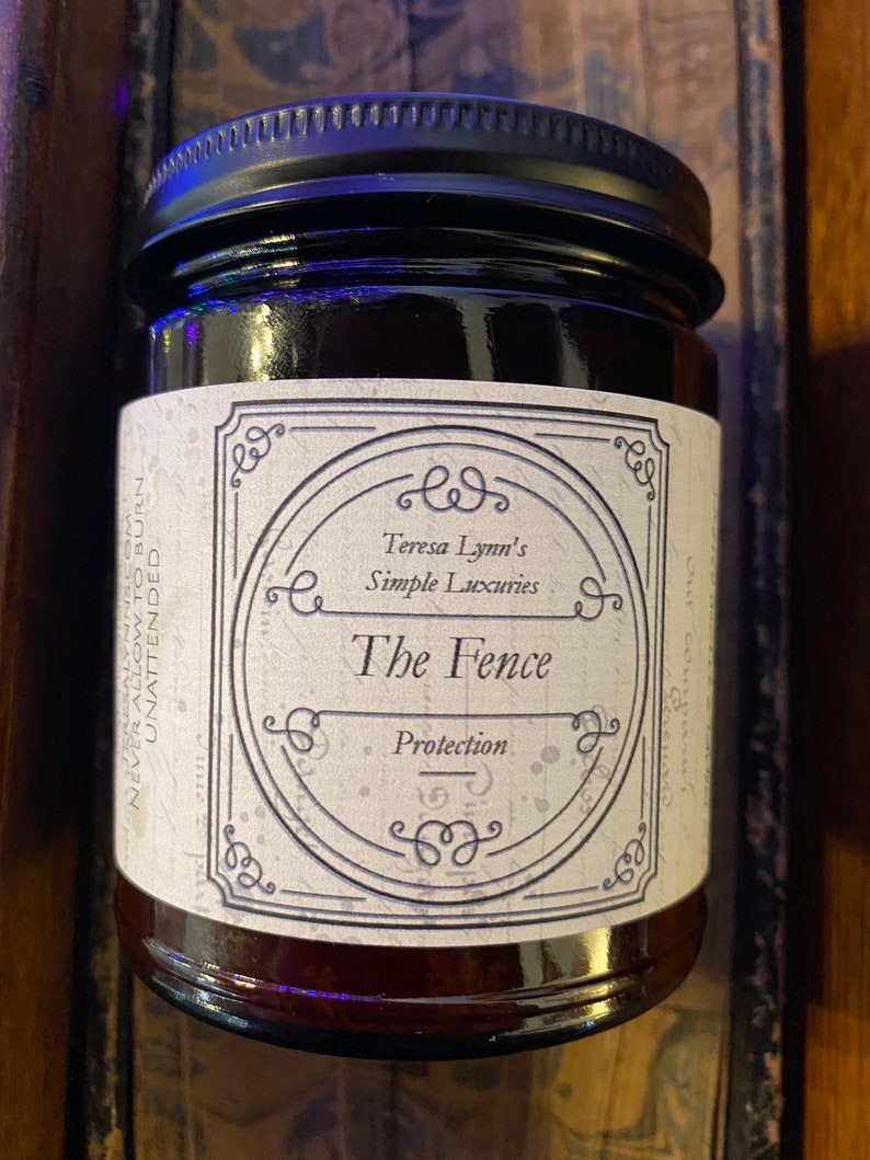 The Fence, Protection and Boundary Setting Wooden Wick Soy Wax Candle in a dark Amber jar with a metal lid.Cedar and Redwood cleansing and protection blessings.
Cedar wood and Redwood essential oil, when used for charms are often referred to as “The fence” due to its powerful characteristic of forcing harmful projections out and keeping protective powers in. Crafted in Monrovia, Indiana at Teresa Lynns Simple Luxuries