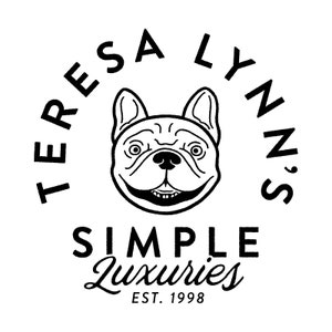 May include: Black and white logo featuring a smiling bulldog illustration. The text "TERESA LYNN'S" arches above the dog, with "SIMPLE Luxuries" below, and "EST. 1998" at the bottom. The design is clean and minimalist.