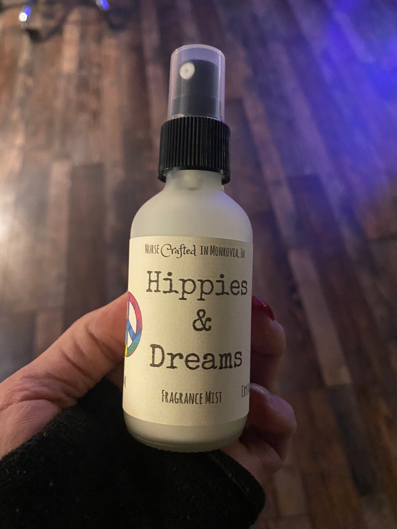 Hippies and Dreams fragrance mist by Teresa Lynns Simple Luxuries.  Presented in ar glass jars with a white linen label and a tie dyed peace sign on the label.