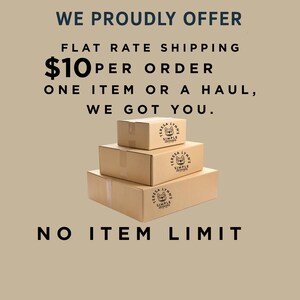 May include: Three stacked cardboard boxes with the text "WE PROUDLY OFFER" and "NO ITEM LIMIT". Each box has a logo that says "TERESA LYNNS SIMPLE". The boxes are on a tan background.