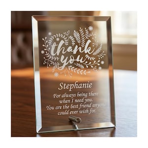 May include: A rectangular glass plaque with a mirrored finish. The words "thank you" are etched in a decorative font, surrounded by floral elements. Below, the name "Stephanie" is inscribed, followed by a personalized message.