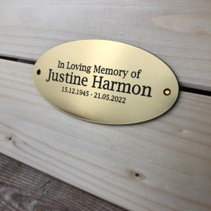 May include: Oval brass plaque with the text "In Loving Memory of Justine Harmon 15.12.1945 - 21.05.2022".