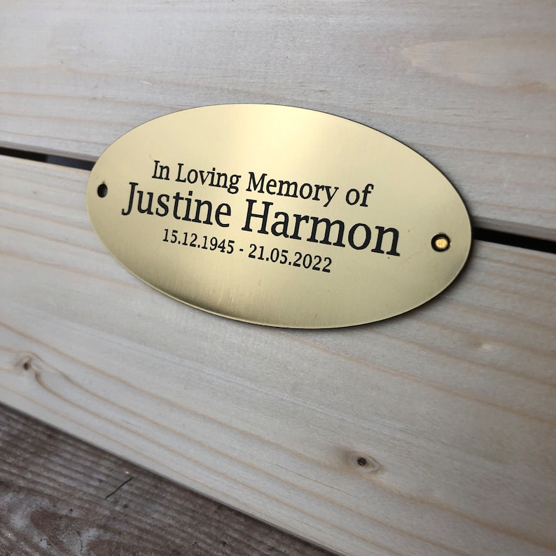 May include: Oval brass plaque with the text "In Loving Memory of Justine Harmon 15.12.1945 - 21.05.2022".