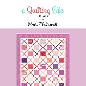 May include: A quilting pattern for a "Heartstrings" quilt, a fat eighth quilt with a pink, red, and purple color scheme. The quilt pattern features a grid of squares with a cross-stitch design.