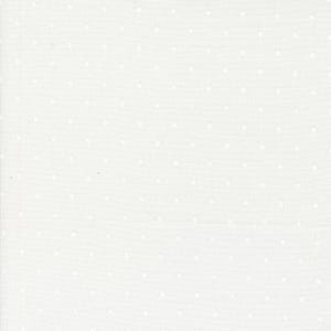 May include: Off-white fabric with a subtle texture and a pattern of evenly spaced, small white dots. The dots are slightly raised, creating a tactile surface. The fabric appears to be a light to medium weight material, suitable for various sewing projects.