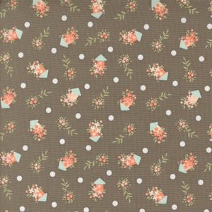May include: A brown fabric with a repeating pattern of small white dots, light green leaves, and light blue houses with pink flowers.