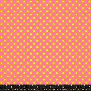 May include: A pink and orange checkered fabric with a repeating pattern of small yellow flowers. The fabric is marked with a ruler in inches and the text "RUBY STAR SOCIETY".