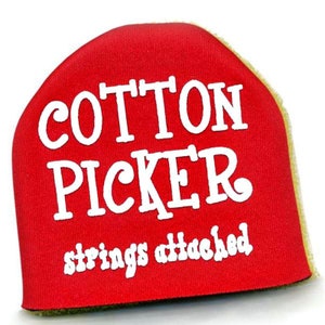 May include: A red fabric item with the words "COTTON PICKER" in large white letters and "strings attached" in smaller white letters. The item has a rounded shape and a yellow-green border.