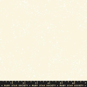 May include: A white fabric with a subtle speckled pattern, resembling a starry night sky. The fabric is a light cream color with tiny white dots scattered across the surface.