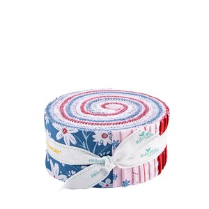 May include: A roll of fabric strips in shades of blue, red, and white, tied with a white ribbon. The fabric features floral patterns and solid colors. The ribbon is printed with the words "Riley Blake Designs".