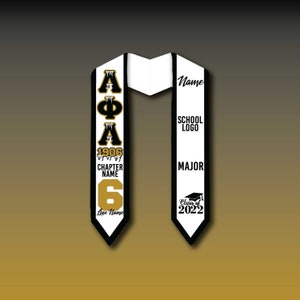 May include: Black and white graduation stole with gold lettering. The stole features the letters "AΦA" and the number "6". The text "Chapter Name" and "Line Name" are also included. The other side of the stole has the text "Name", "School Logo", "Major", and "Class of 2022".