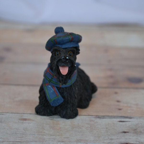 Scottish Terrier (scottie dog) Christmas statue with a blue/red scarf and hat