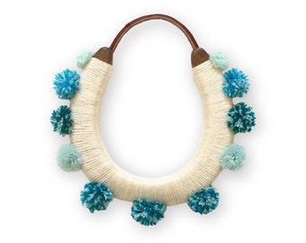 lucky yarn wrapped pom pom horseshoe