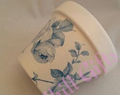 Hand Decoupaged plant pot decorated with shabby chic blue climbing roses