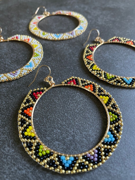 Woven bead hoop best sale earrings