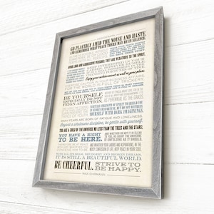 May include: A framed print with a white background and blue and black text. The text is a poem titled "Desiderata" by Max Ehrmann. The poem is about living a peaceful and fulfilling life.
