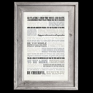 May include: A framed black and white print with a motivational quote by Max Ehrmann called "Desiderata". The quote is printed in a vintage typewriter font and includes advice on how to live a good life.