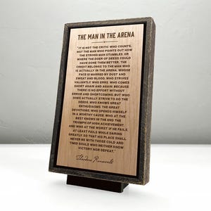 The Man in the Arena Theodore Roosevelt quote — engraved wood plaque — solid hardwood with a handcrafted floating frame.