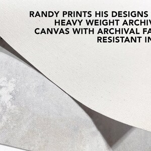 May include: Close-up of a white canvas texture. The text "RANDY PRINTS HIS DESIGNS ON HEAVY WEIGHT ARCHIVAL CANVAS WITH ARCHIVAL FADE RESISTANT INKS" is printed on the canvas.