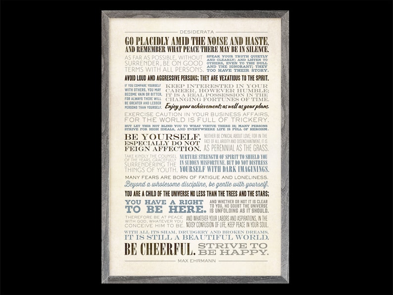 May include: A framed print with a white background and brown text. The text is a poem titled "Desiderata" by Max Ehrmann. The poem is about living a peaceful and fulfilling life. The print is framed in a light gray wood frame.