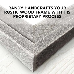 May include: Close-up of a corner of a rustic wood frame. The frame is made of weathered wood with a gray finish. The text "RANDY HANDCRAFTS YOUR RUSTIC WOOD FRAME WITH HIS PROPRIETARY PROCESS" is visible at the top of the image.