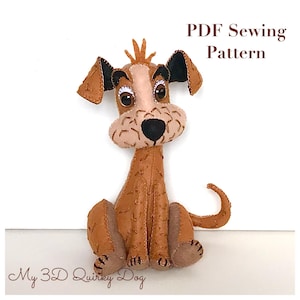 May include: PDF sewing pattern for a 3D quirky dog. The dog is brown with a tan face and black ears. The dog is sitting with its tail curled around its legs. The text "My 3D Quirky Dog" is at the bottom of the image.