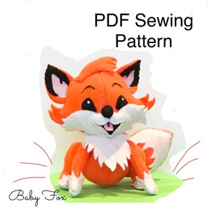 May include: PDF sewing pattern for a cute orange and white baby fox plush toy. The fox has big eyes, a pink nose, and a happy expression. The pattern includes instructions for making the fox's body, head, ears, and tail.
