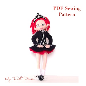 May include: PDF sewing pattern for a felt doll dressed in a black Irish dancing costume with a red skirt and a white crown. The doll has red hair and blue eyes. The pattern is titled "My Irish Dancer".