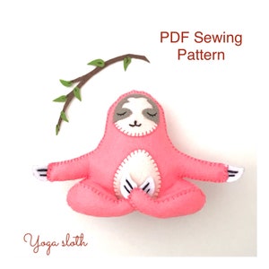 May include: PDF sewing pattern for a pink yoga sloth plush toy. The sloth is sitting in a yoga pose with its eyes closed. The pattern includes a branch with leaves above the sloth.