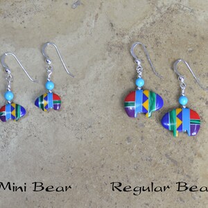 May include: Two pairs of sterling silver earrings with turquoise beads and colorful bear designs. The earrings are labeled "Mini Bear" and "Regular Bear".
