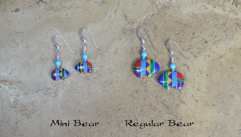 May include: Two pairs of sterling silver earrings with turquoise beads and colorful bear designs. The earrings are labeled "Mini Bear" and "Regular Bear".