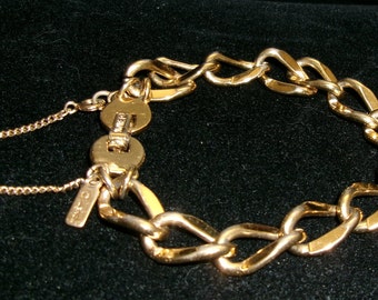 Monet GOLD tone link bracelet with safety chain