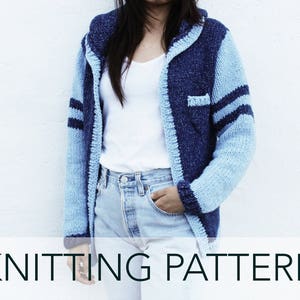 May include: A blue and white knitted cardigan with a hood and striped sleeves. The cardigan is open in the front and has a pocket on the left side.