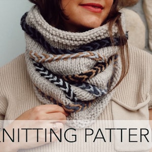May include: Knitting pattern for a beige cowl with blue, black, and brown stripes. The cowl is worn by a person with long brown hair.