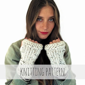 May include: A knitting pattern for white fingerless gloves with a speckled texture. The gloves are shown being worn by a person with long brown hair and a green jacket. The text "Knitting Pattern" is displayed across the bottom of the image.