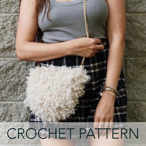 May include: A white crocheted fluffy bag with a gold chain strap. The bag is worn by a person wearing a gray tank top and a black and white plaid skirt. CROCHET PATTERN is written in black text at the bottom of the image.