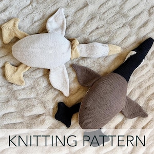 May include: Two knitted goose toys, one white and one brown, with wings and feet. The white goose has tan feet and a tan neck detail. The brown goose has black feet and a black and white head. The text "KNITTING PATTERN" is at the bottom.