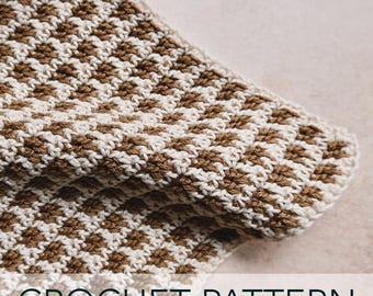 May include: Crochet pattern for a brown and white striped blanket. The blanket is made with a simple stitch and has a textured look.