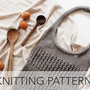 May include: Knitting pattern for a gray crocheted tote bag with a simple design. The bag is laying on a beige fabric with wooden spoons and eggs.