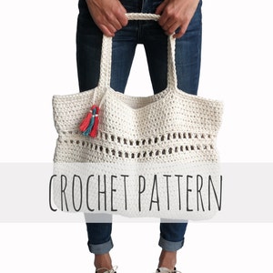 May include: A white crochet tote bag with a crocheted handle and colorful tassels. The bag is large enough to carry everyday essentials. CROCHET PATTERN is written in black text on a white background.