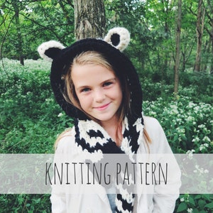 May include: A black and white striped knit hooded scarf with bear ears. The scarf is worn by a child in a white jacket, standing in a forest setting. The text "Knitting Pattern" is displayed on a white banner.