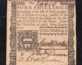 May include: A vintage one shilling bill from Pennsylvania, dated April 1772. The bill features a coat of arms and the text "No. 14610 ONE SHILLING."