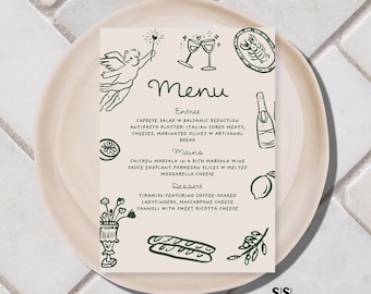 Puede incluir: Una tarjeta de menú beige con ilustraciones y texto verdes, colocada sobre un plato beige a juego. El menú presenta secciones para Entrante, Platos principales y Postre, con descripciones detalladas de cada plato. La tarjeta está sobre un fondo de baldosas blancas.