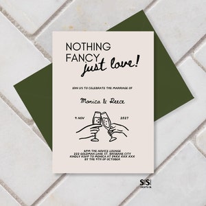May include: A wedding invitation with a minimalist design. The invitation features a simple illustration of two hands holding champagne glasses, with the text "NOTHING FANCY just love!" above the illustration. The invitation also includes the names "Monica & Reece" and the date "9 NOV 2027".