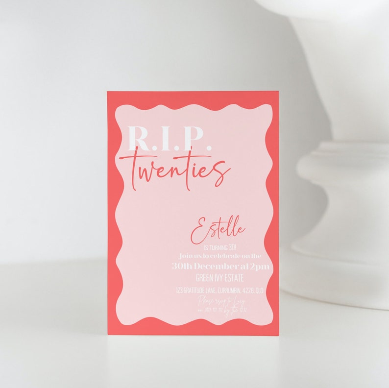 May include: A rectangular invitation card with a coral border and a light pink interior. The text "R.I.P. Twenties" is at the top, with "Estelle" and event details below. The card is for a 30th birthday celebration.