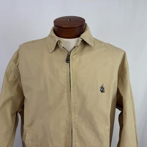 Vintage Nautica kaki windbreaker, maat L, jaren 90, met ritssluiting aan de voorkant, zoals hij is.