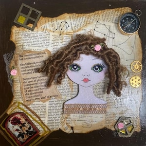 May include: A mixed media collage featuring a central illustration of a person with brown yarn hair, green eyes, and a pink rose accessory. The background consists of vintage book pages, a compass, small metal gears, and decorative frames.