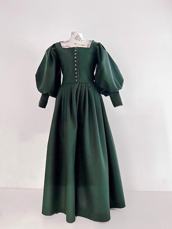 16th century renaissance dark green wool dress with wide puffed sleeves long fitted cuffs pleated skirt and front metal button closure gown 16th century renaissance dark green wool dress with wide puffed sleeves long fitted cuffs pleated skirt and front metal button closure gown